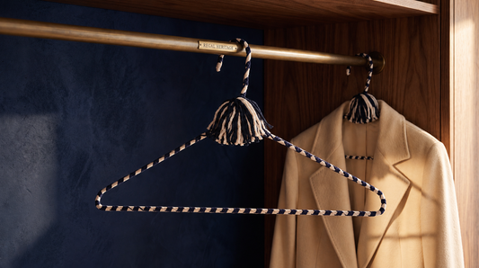 Regal Heritage navy-and-ivory hand-knotted cotton hanger in a sophisticated dark wardrobe