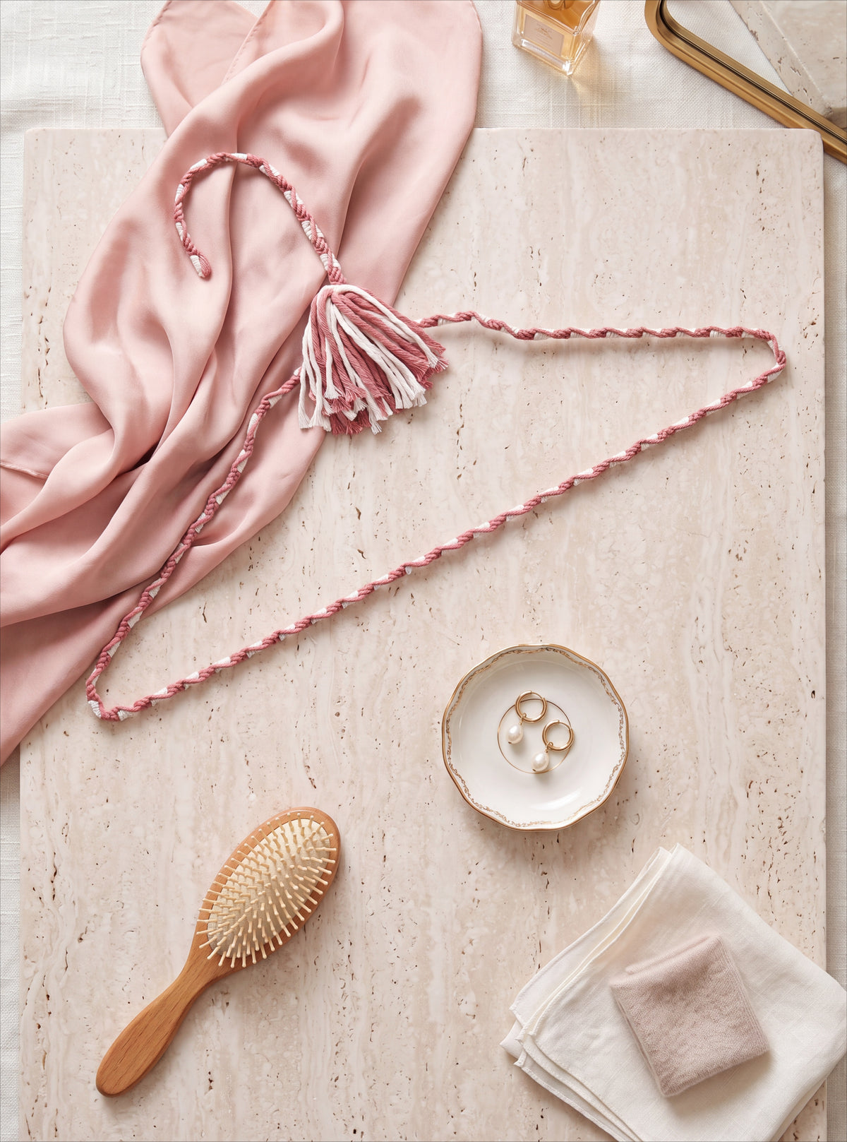 Blush Cameo cotton hanger styled with rose fabric and elegant dressing-room accessories