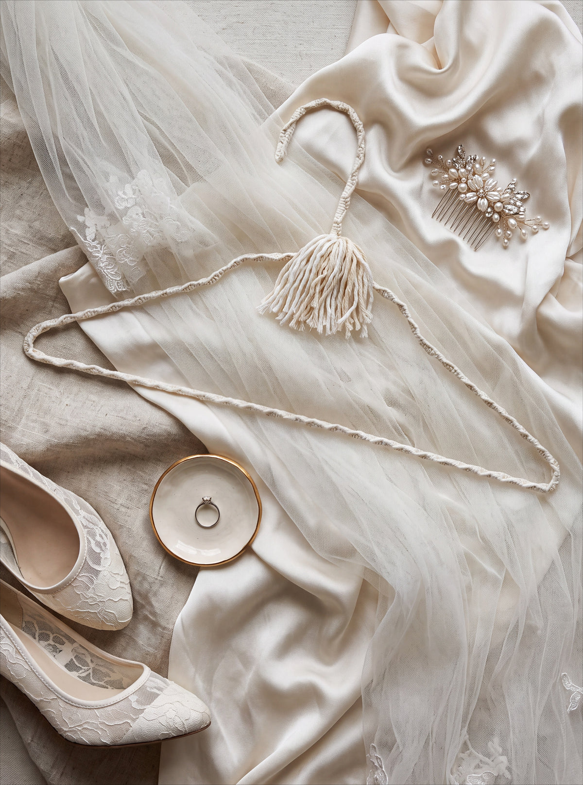Close-up of a Bridal Veil hand-knotted cotton hanger with ivory thread and sewing details