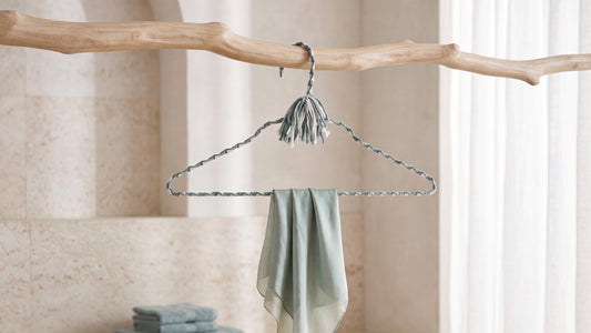 Coastal Spa blue-green and ivory hand-knotted cotton hanger in a serene neutral closet