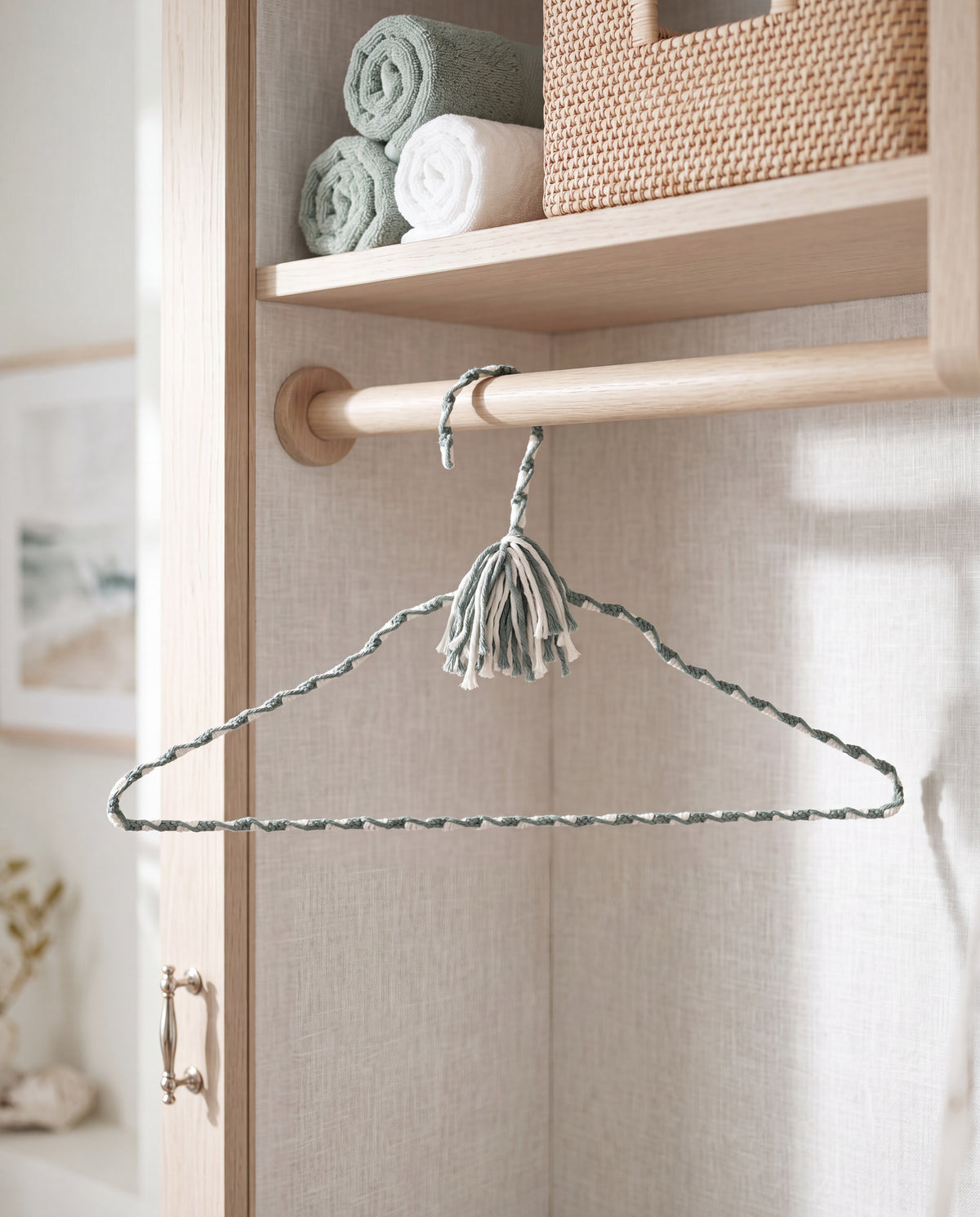 Coastal Spa hand-knotted cotton hanger displayed in a calm light-filled wardrobe