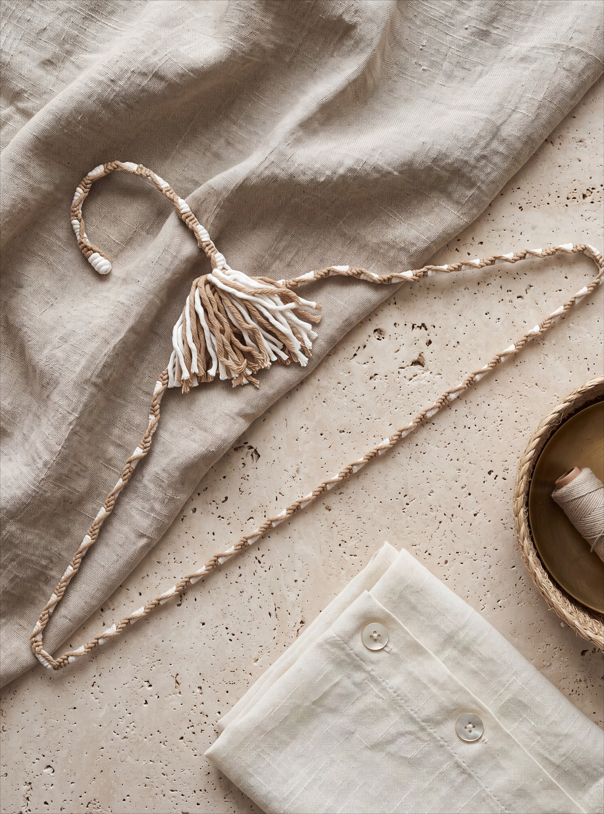 Natural Linen hanger craftsmanship shown with cream fabric and decorative sewing details
